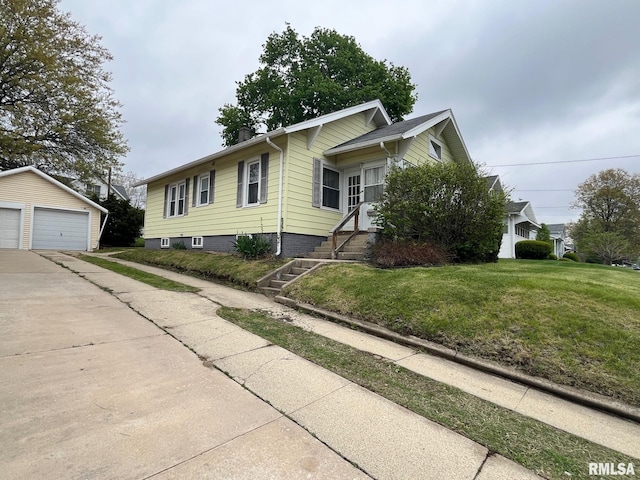 view of front facade featuring a detached garage, an outbuilding, a chimney, and a front yard