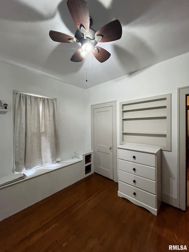 unfurnished bedroom with a ceiling fan and wood finished floors