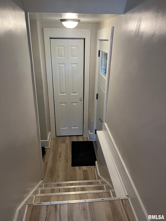 doorway with wood finished floors