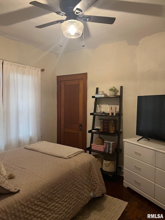bedroom featuring ceiling fan and dark wood-style floors