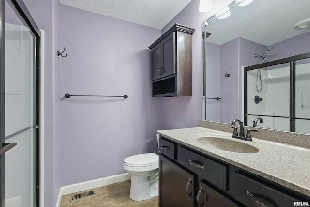 bathroom featuring toilet, a textured ceiling, baseboards, a shower stall, and visible vents
