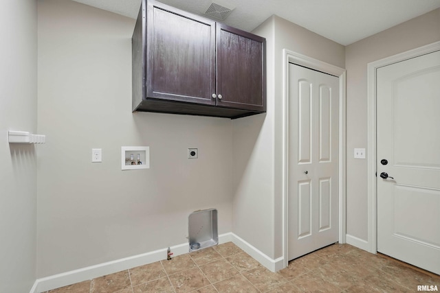 clothes washing area featuring cabinet space, hookup for a washing machine, gas dryer hookup, baseboards, and visible vents