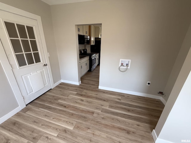 clothes washing area with washer hookup, baseboards, laundry area, and electric dryer hookup