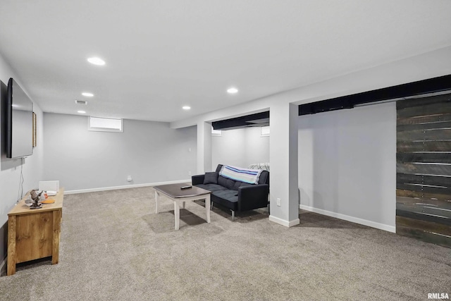 living area featuring baseboards, carpet flooring, recessed lighting, and visible vents