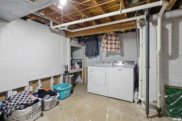 unfinished basement with washing machine and dryer