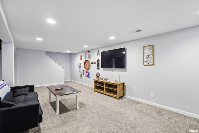 carpeted living room with recessed lighting, baseboards, and visible vents