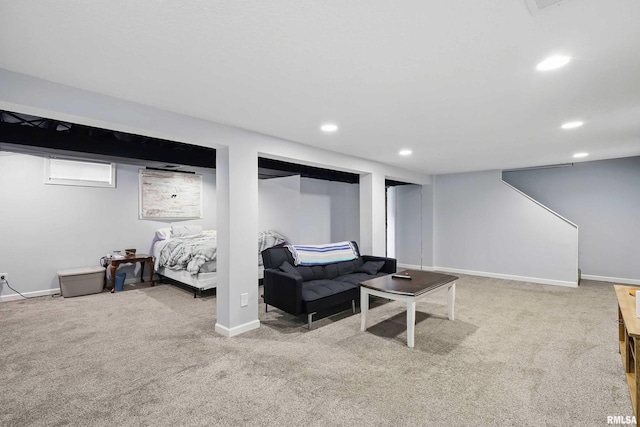 carpeted living area featuring baseboards and recessed lighting