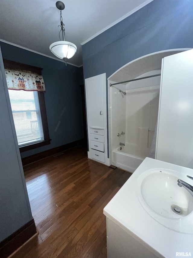 full bath featuring shower / washtub combination, wood finished floors, and vanity