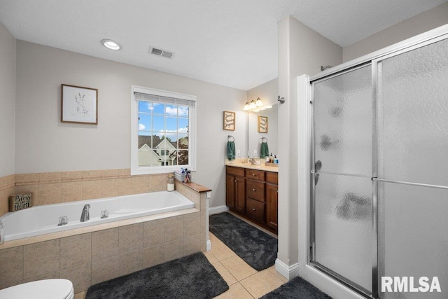 bathroom featuring visible vents, a garden tub, vanity, tile patterned floors, and a stall shower