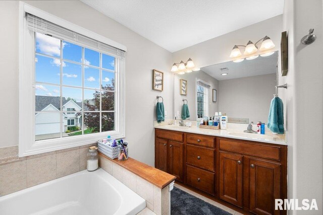 full bath featuring double vanity, a sink, a bath, and visible vents