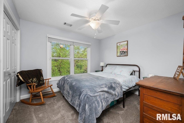 bedroom featuring a closet, visible vents, baseboards, ceiling fan, and carpet flooring