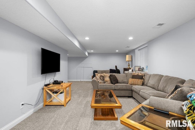 carpeted living room featuring baseboards and recessed lighting
