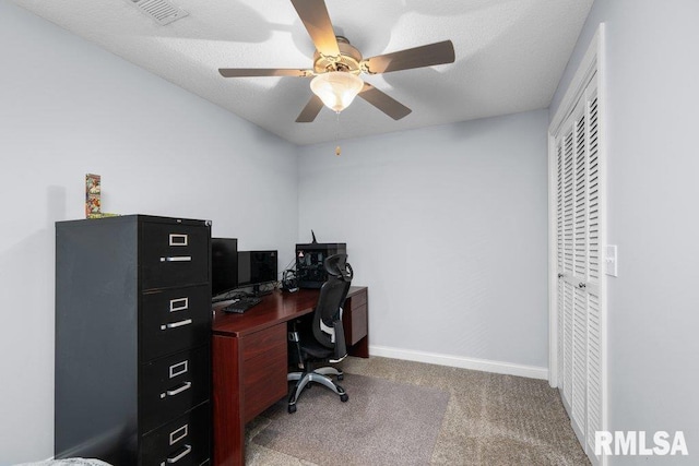 carpeted home office featuring a ceiling fan, baseboards, and visible vents