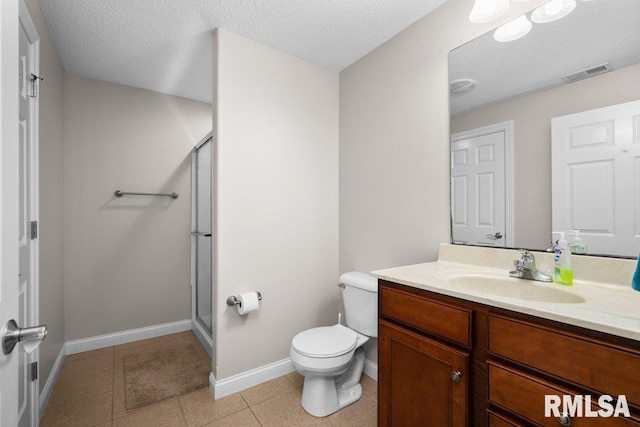 bathroom featuring visible vents, vanity, toilet, and a shower stall