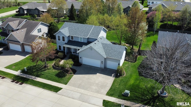birds eye view of property with a residential view