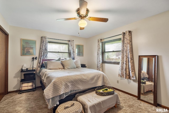 bedroom with baseboards, a closet, light carpet, and ceiling fan
