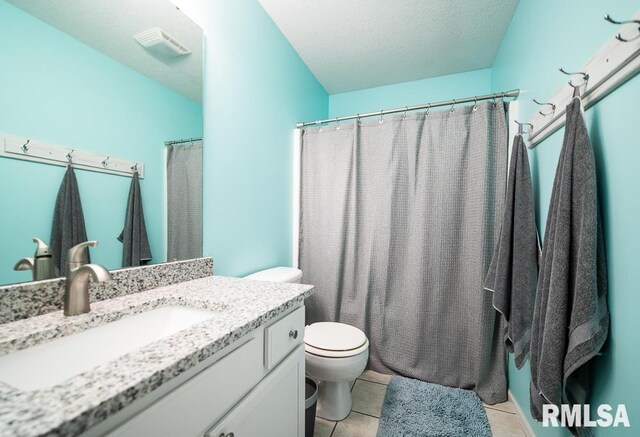 full bath with vanity, tile patterned flooring, toilet, a textured ceiling, and a shower with curtain