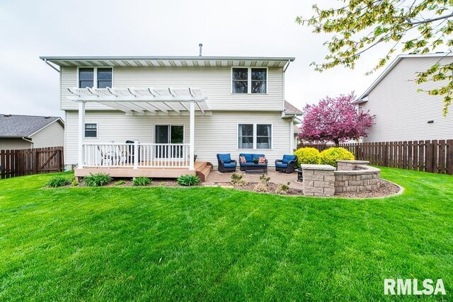 rear view of property with a pergola, a wooden deck, a fenced backyard, an outdoor living space, and a lawn