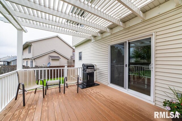wooden terrace with a pergola and grilling area