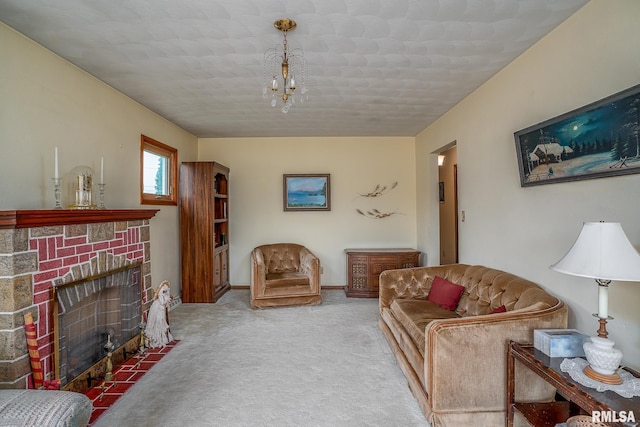 living area featuring an inviting chandelier, baseboards, a fireplace, and carpet flooring