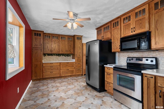 kitchen featuring light countertops, ceiling fan, brown cabinetry, and black appliances