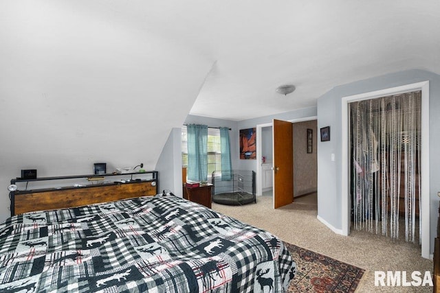 bedroom with carpet floors and baseboards