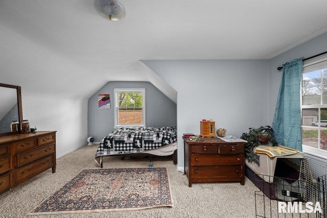 bedroom featuring carpet floors and vaulted ceiling
