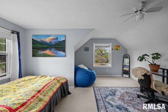 bedroom with baseboards, carpet, a ceiling fan, and lofted ceiling