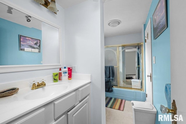 bathroom featuring an enclosed shower, toilet, and vanity