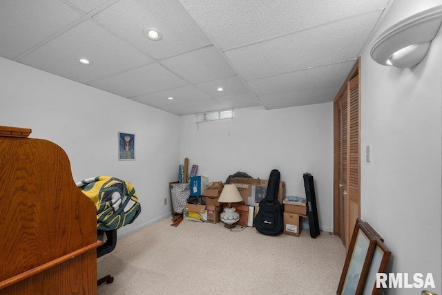 interior space with recessed lighting, baseboards, a paneled ceiling, and carpet