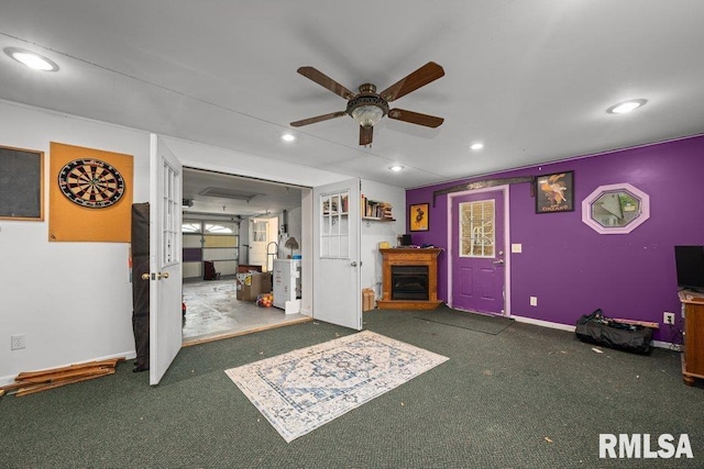 unfurnished living room with recessed lighting, carpet flooring, ceiling fan, and a fireplace