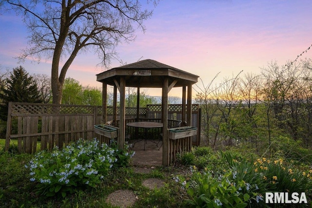 view of yard with a deck, a gazebo, and fence