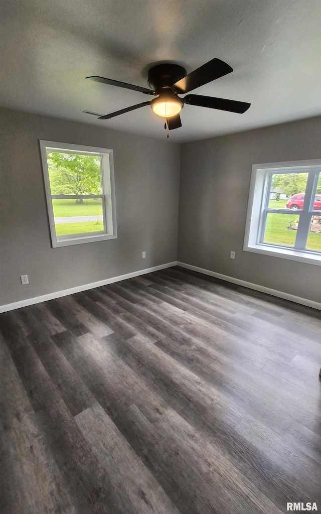 116 Ballantine St, Duquoin, IL 62832 - empty room featuring dark wood finished floors and a ceiling fan
