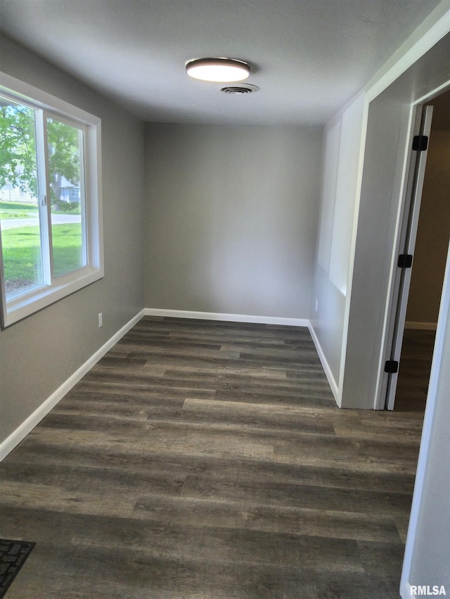 116 Ballantine St, Duquoin, IL 62832 - unfurnished room with dark wood-type flooring