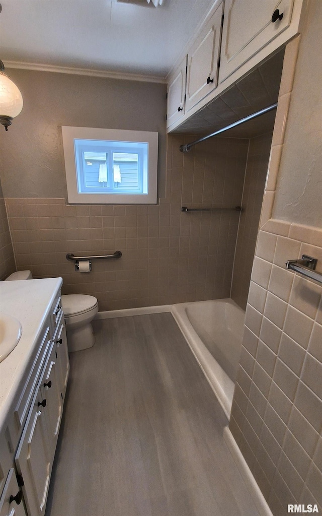 116 Ballantine St, Duquoin, IL 62832 - full bath with tile walls, wood finished floors, vanity, crown molding, and wainscoting
