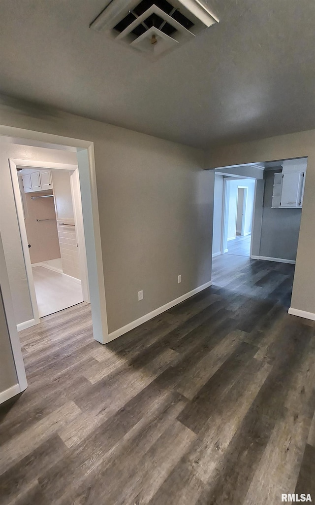 116 Ballantine St, Duquoin, IL 62832 - empty room with dark wood-style flooring