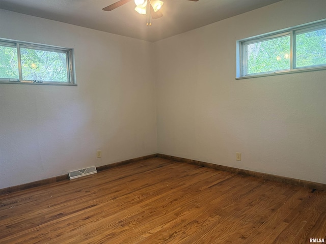 2000 W Gray Dr, Carbondale, IL 62901 - unfurnished room featuring visible vents, baseboards, ceiling fan, and wood finished floors