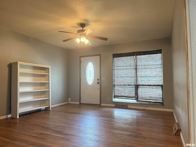 2000 W Gray Dr, Carbondale, IL 62901 - entryway featuring baseboards, ceiling fan, dark wood-style floors, and visible vents