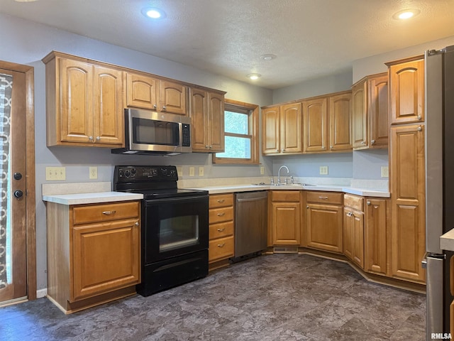 2000 W Gray Dr, Carbondale, IL 62901 - kitchen with a sink, light countertops, stainless steel appliances, and a textured ceiling