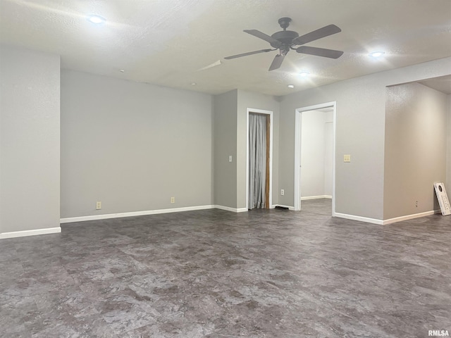 2000 W Gray Dr, Carbondale, IL 62901 - unfurnished room featuring a textured ceiling, ceiling fan, and baseboards