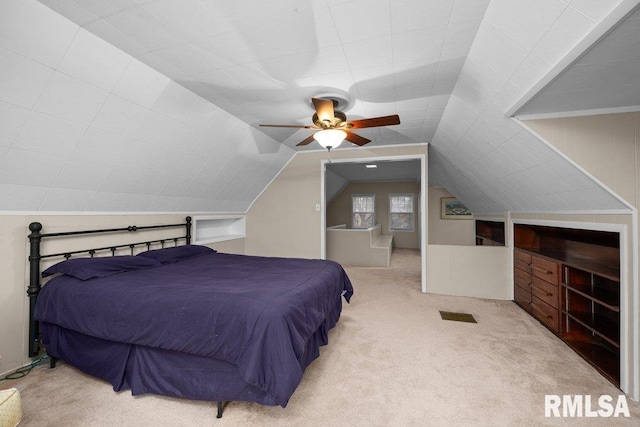 bedroom with a ceiling fan, carpet, and vaulted ceiling
