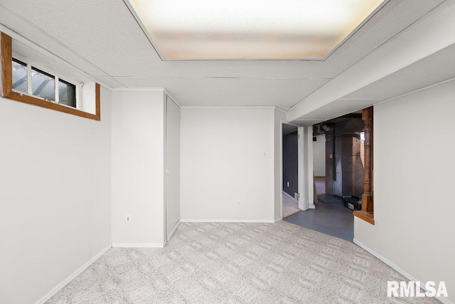 finished basement with baseboards and carpet