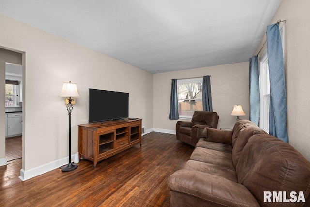 living room with baseboards and dark wood-style floors