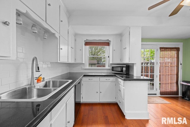 kitchen with a sink and white cabinetry