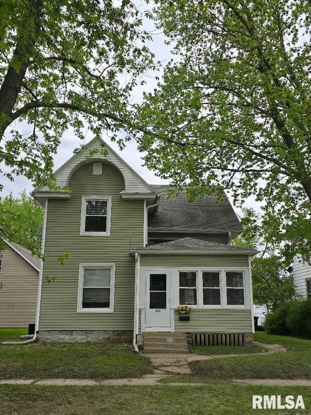 view of front of home featuring a shingled roof and entry steps
