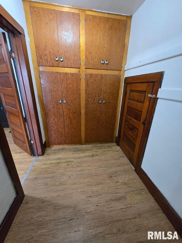 hall featuring wood finished floors