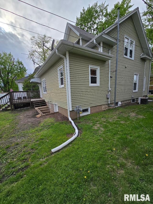 back of house with a lawn, a deck, and cooling unit
