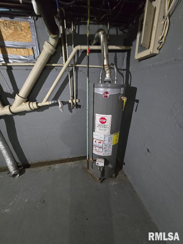 utility room featuring electric panel and gas water heater