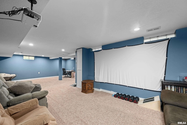 cinema room with carpet flooring, recessed lighting, baseboards, and visible vents
