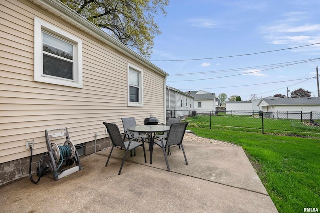 view of patio with outdoor dining area and fence